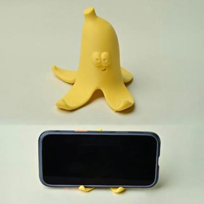 Yousheng Cute Yellow Banana Peel Phone Holder 3D Printed Funny Banana Desktop Cell Phone Stand for All Mobile Phones