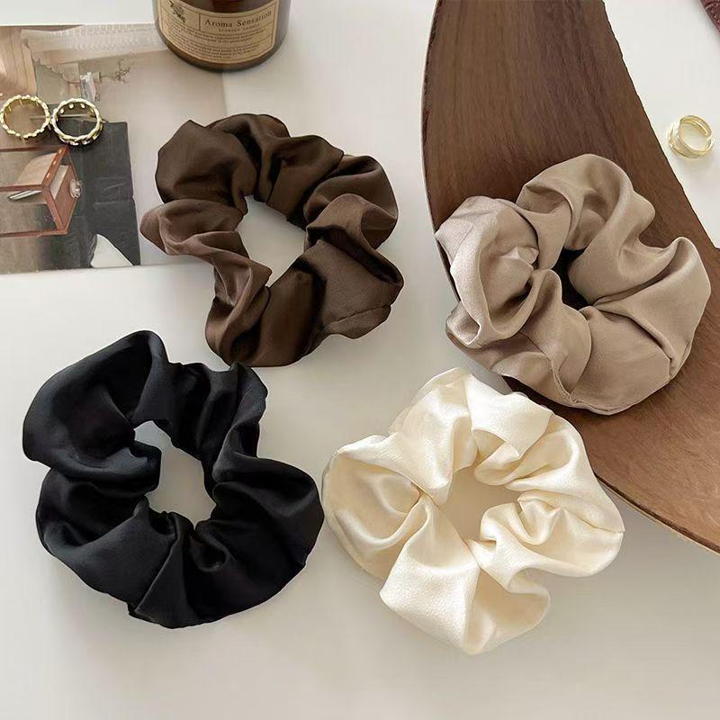 Satin-Feel Scrunchie: Versatile Luxury Hair Tie for Women, Elevates Style & Compliments Skin Tone.