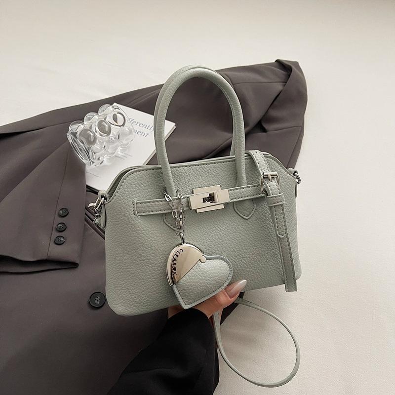 Simple temperament hand bag women's spring new niche fashion messenger bag commuter shoulder bag