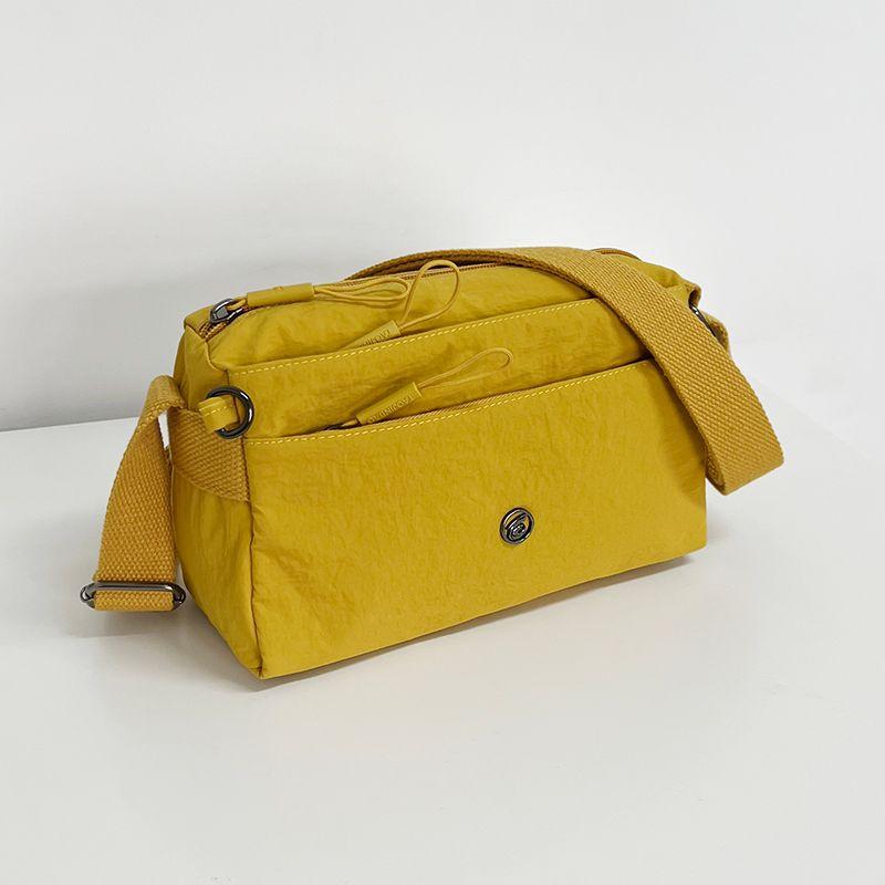 

Multi-Compartment Lightweight Bags Women s 2025 New Crossbody Bag Casual Canvas Bag Nylon Bag Mother Bag Small Cloth Bag Egg yolk quicksand