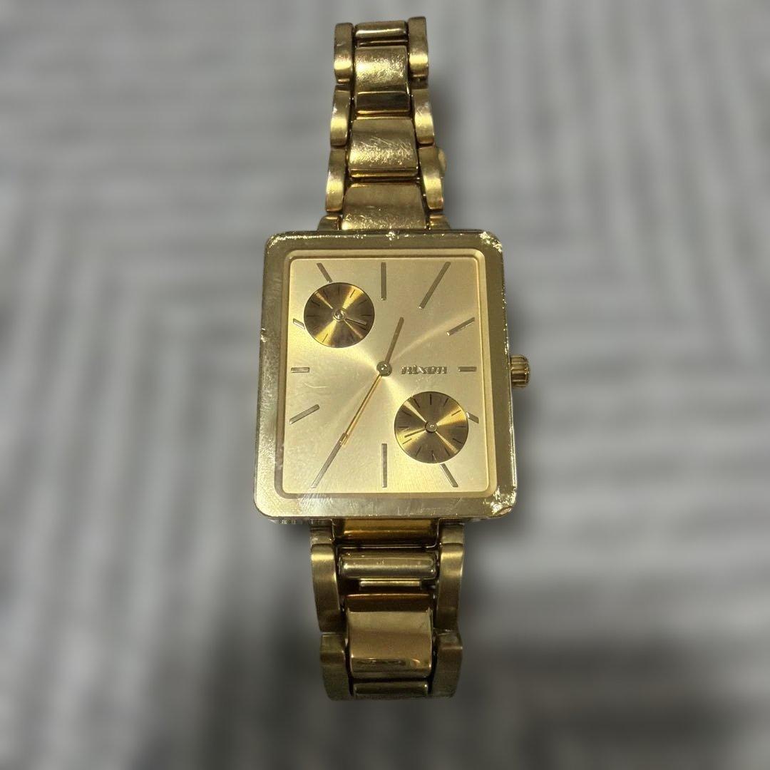 Used NIXON watch gold