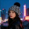 Zebra pattern hairball knitted hat women's autumn and winter retro versatile face small wool hat cold-proof warm ear hat