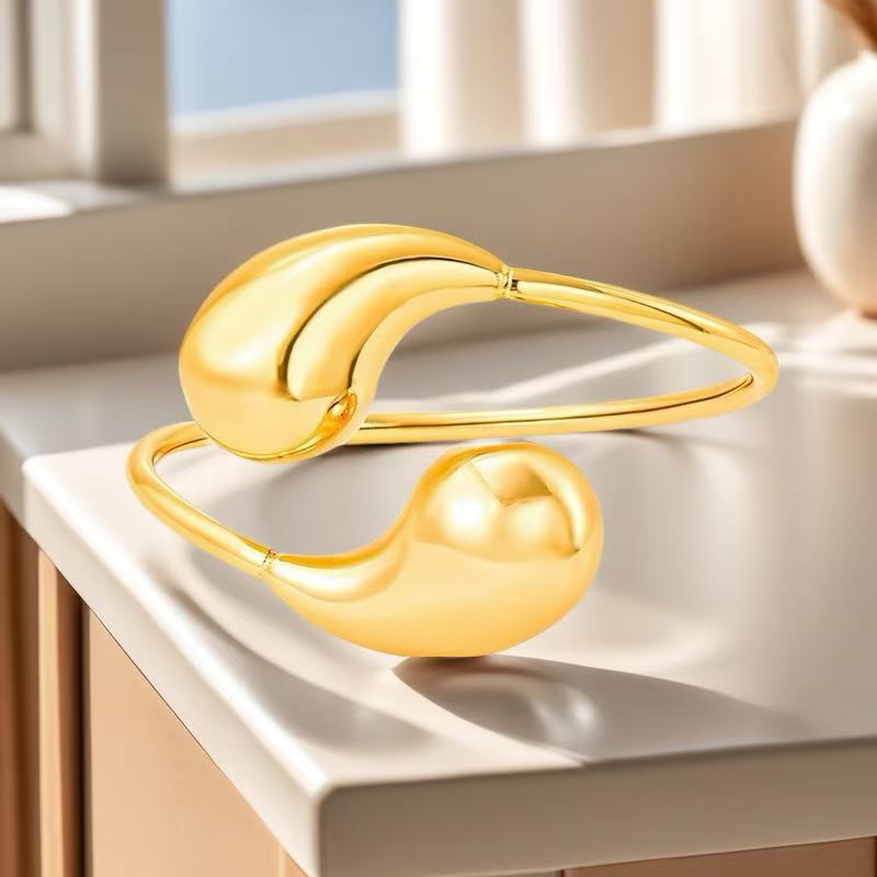 Bracciale con Apertura Irregolare a Goccia Design Atmosferico di Alta Gamma