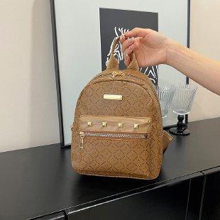 Schoolbag fashion PU travel small backpack storage Korean version lady temperament rivet small backpack trend small backpack