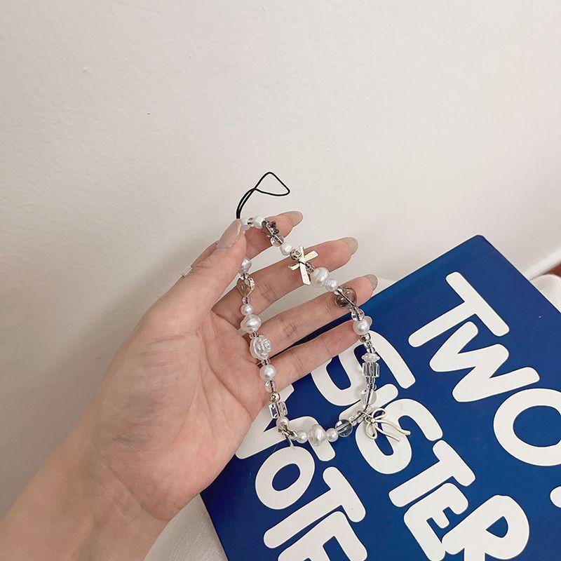 

Ins Girl Heart Transparent Bead Silver Bow Phone Chain Hanging Decoration CCD Camera Pendant Hand Rope Anti Loss Female