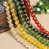 Six-Character Mantra Crystal Bead Bracelet with Black, White, Red, Green, and Yellow Spacer Beads.