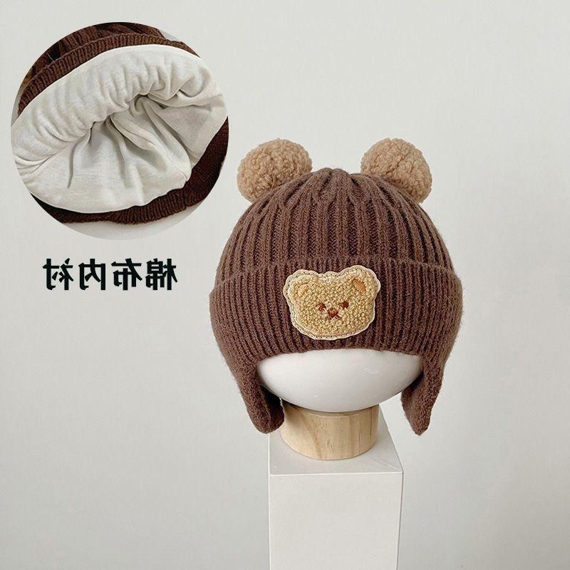 Kinderhüte Herbst und Winter Jungen niedlich super niedlich gestrickte Wollmütze Mädchen winddichte Ohrenschützer Baby verdickte warme Mütze