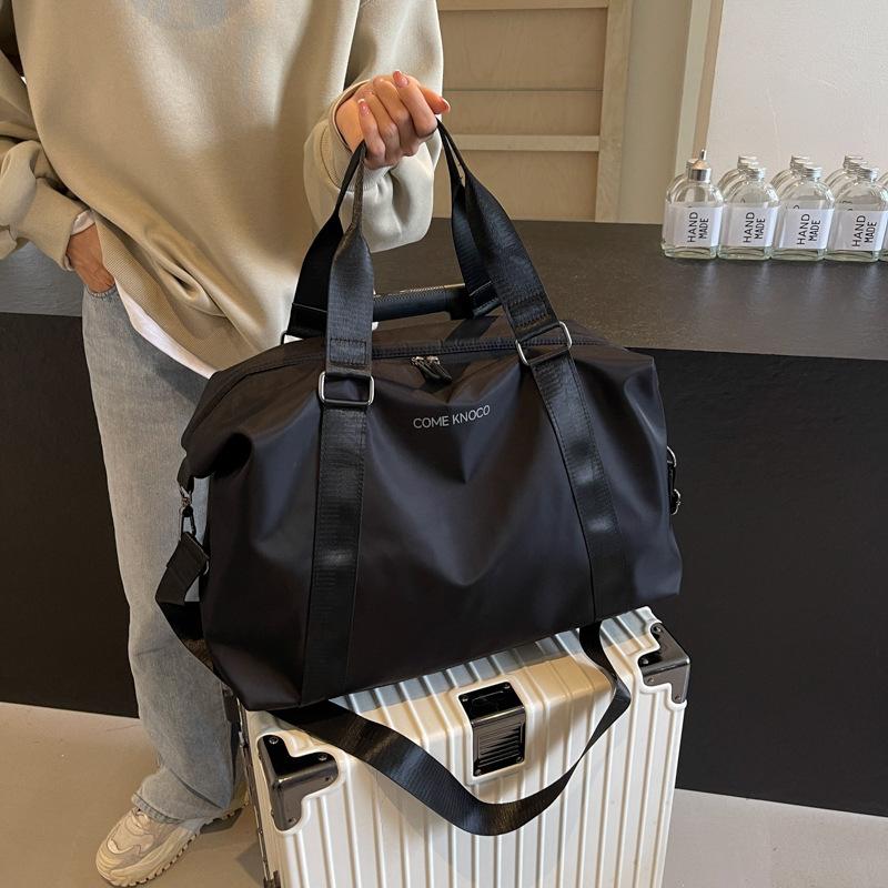 Korean version of fashion short-distance travel bag women's shoulder carry large-capacity luggage travel business travel bag men