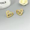 Boucles d'oreilles Clous Cœur Creux Incrustées de Zircon Mode Luxe Léger Tempérament Haut de Gamme Boucles d'oreilles pour Femmes