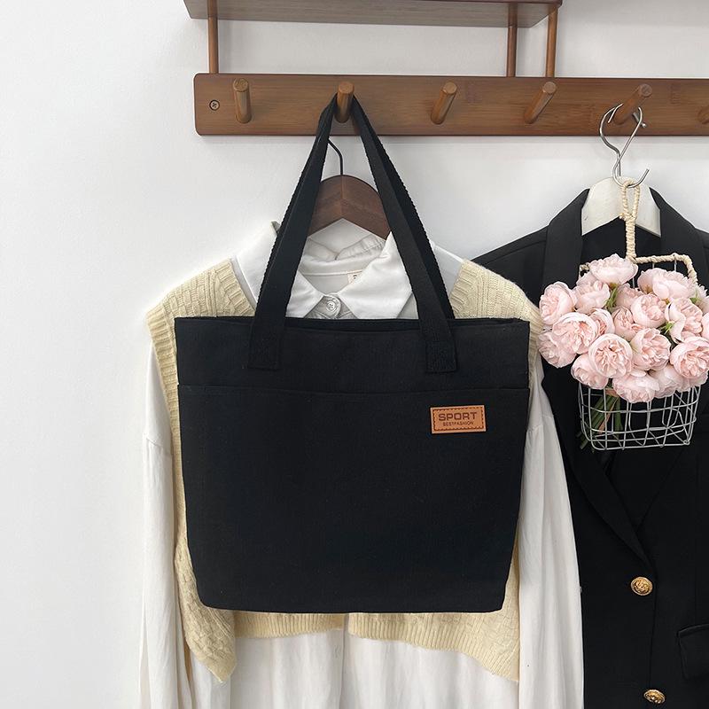 Women's Versatile Canvas Tote - Lightweight, Large Capacity, Single Shoulder or Handheld Bag for Students and Commuters.