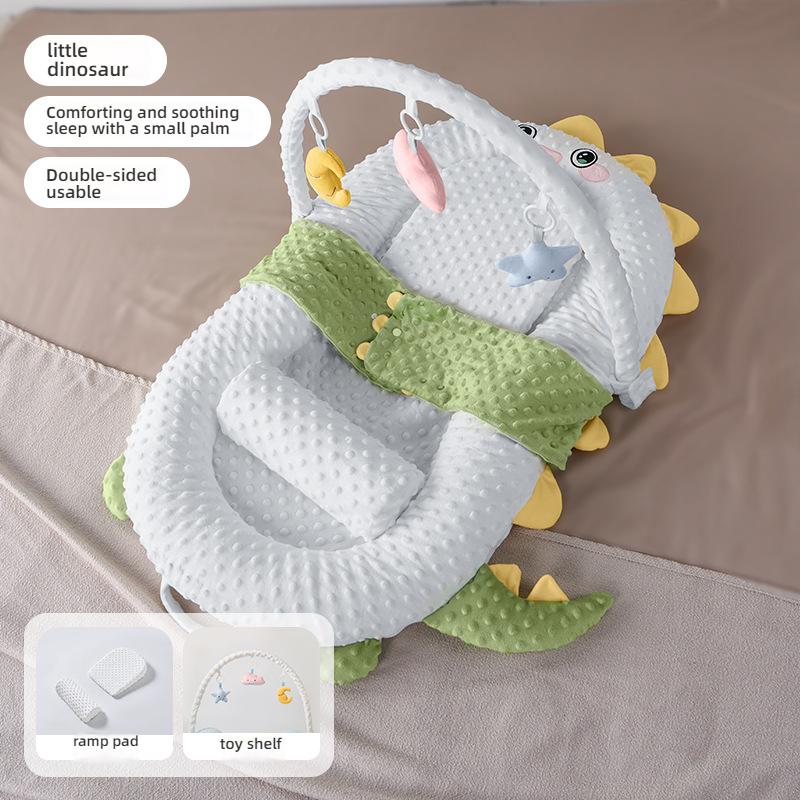 The Newborn Comfort Cradle with a Sloping Pad, Footrest, and Toy Shelf by Little Dinosaur Creates a Cozy and Warm Cradle Bed