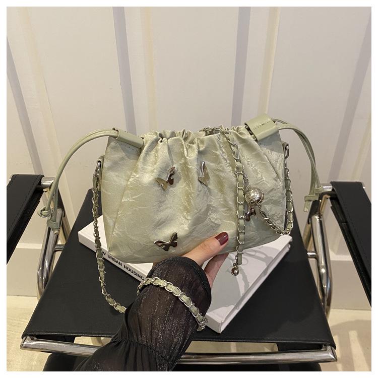 High-End Women's Metallic Bow Bucket Bag - Autumn 2024 Niche Fashion Drawstring Style