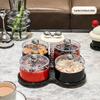 Luxuriöse Obst- und Süßigkeitenschale: Festliche Aufbewahrung für Snacks auf dem Couchtisch.