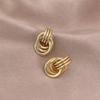 Gold-Tone Geometric Twist Earrings: Fashionable and Versatile Multi-Layer Braided Earrings for Women.