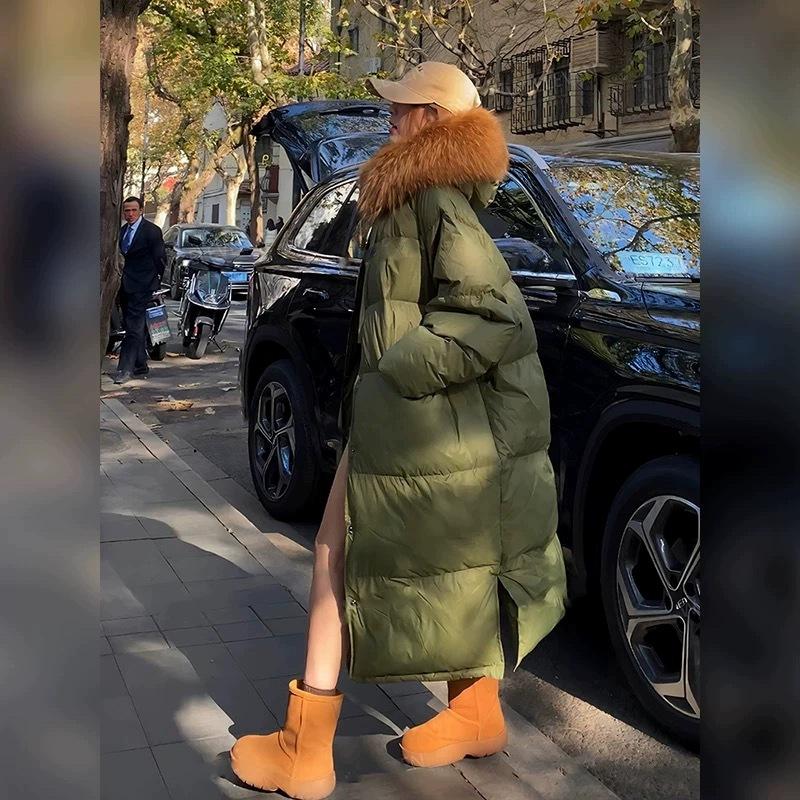 

Пуховик женский длинный с большим меховым воротником из енота премиум-класса, модный зимний 2025, длиной ниже колена, большого размера, свободный, маскирующий фигуру One size