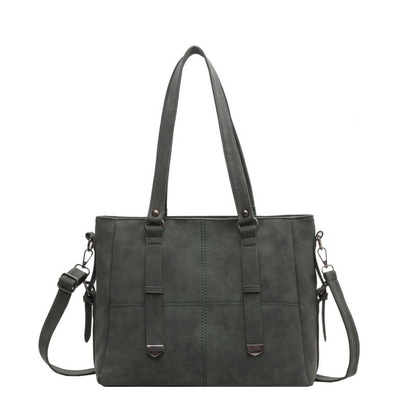 

Жіноча шкіряна сумка великої місткості через плече. Однотонна сумка зелений