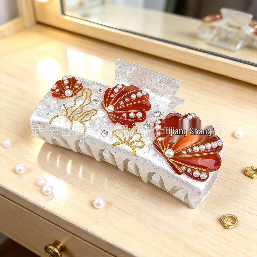 Elegancka spinka do włosów z cyrkoniami w kształcie rozgwiazdy i muszelkowa klamra do upięć