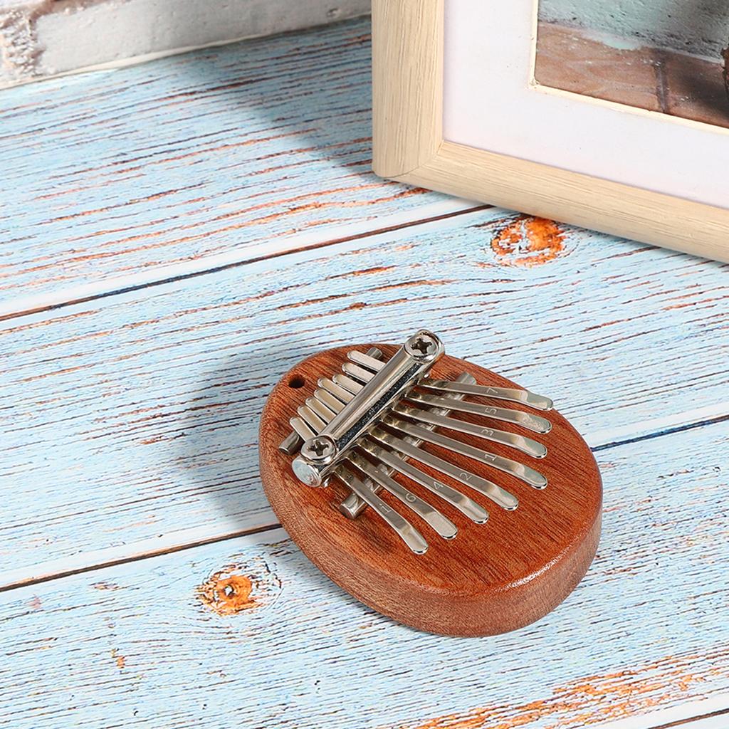 Thumb Piano 8 Keys Mini Portable Acrylic Material Decoration Gift Musical InstrumentOval Crude Wood
