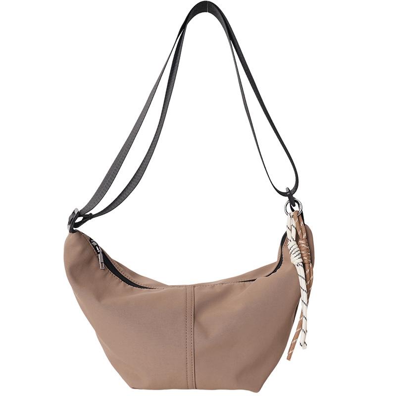 Lichtgewicht veelzijdige canvas tas dames nieuwe zomer populaire schoudertas niche schouder knoedeltas