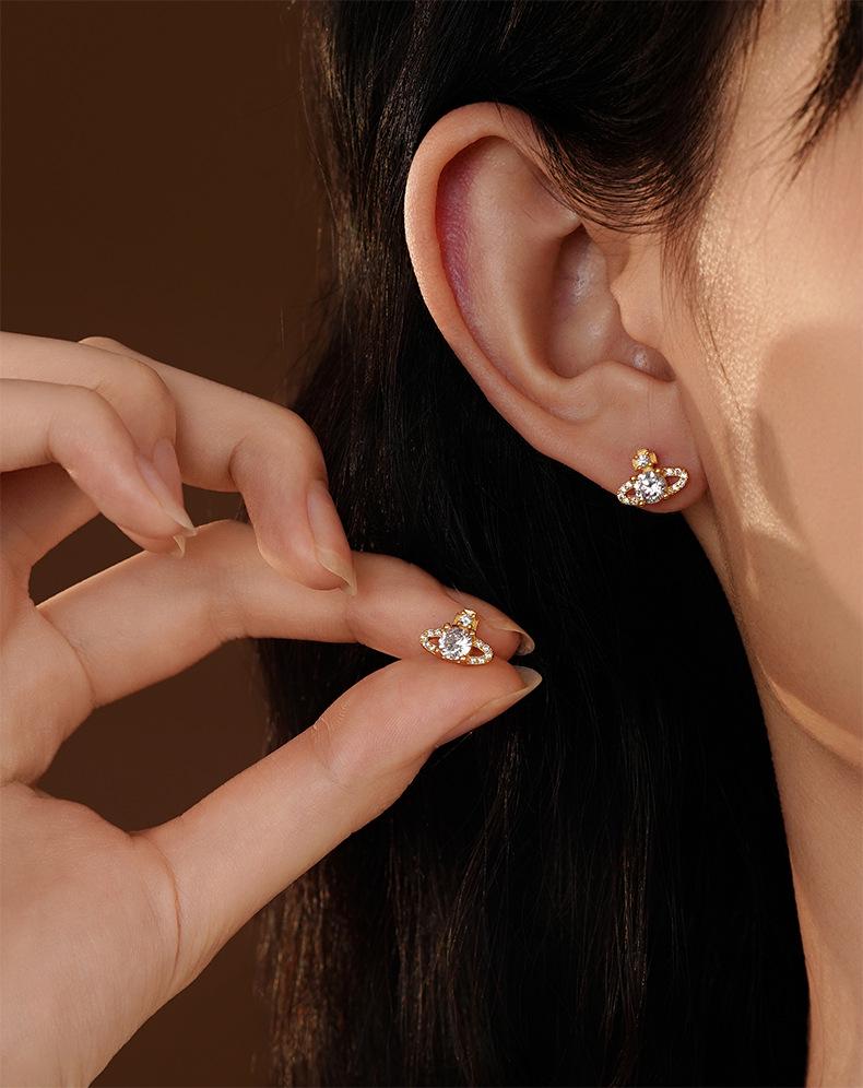 Ohrstecker Saturn aus S925 Sterlingsilber im koreanischen Stil für Damen - Mit Diamanten besetzt, super glänzend, kleines leicht luxuriöses Zirkon-Design