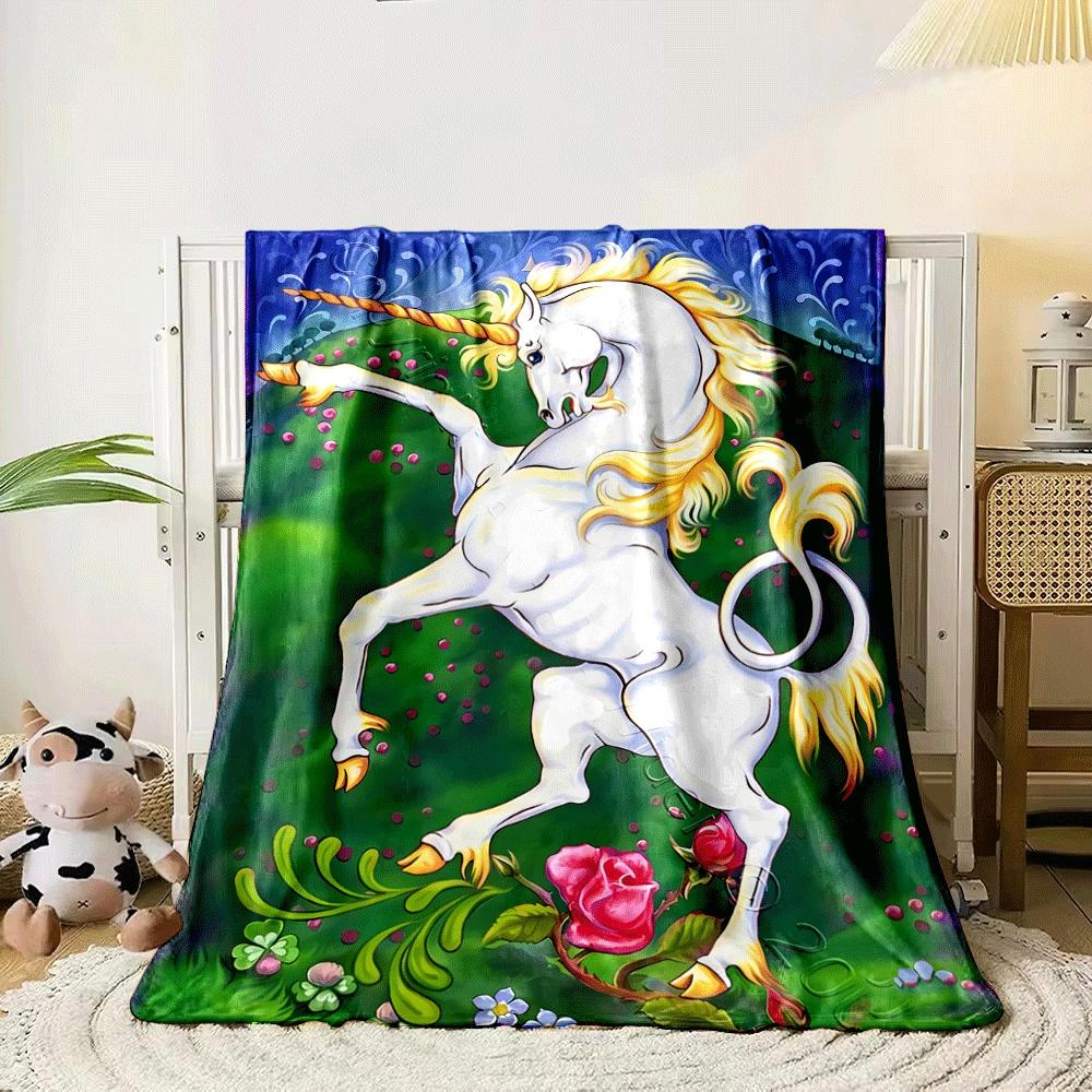 A white unicorn with golden mane stands on grass with vibrant flowers. for all seasons blanket lunch break throw gift 80cm x 120cm