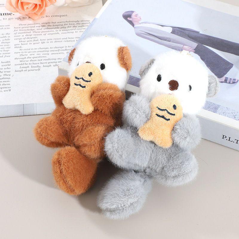 Cartoon Sea Otter Plush Keychain: Cute Fish-Hugging Sea Dog Pendant for Backpacks & More