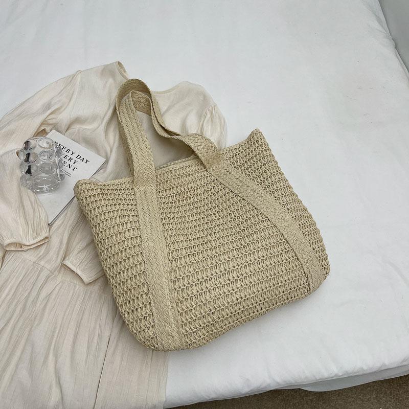 Handwoven Straw Tote Bag Women's Summer Beach Bag with Tassel Detail and Lightweight Design