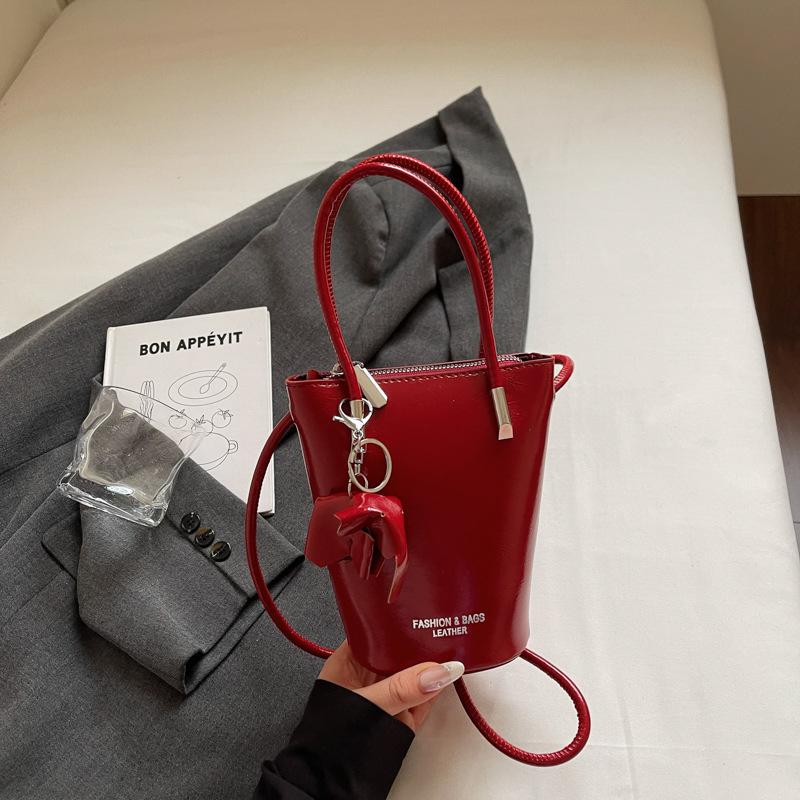 

2025 summer new bag fashionable and simple foreign style handbag shoulder bucket bag Korean version oblique span bag women s bag бордовый
