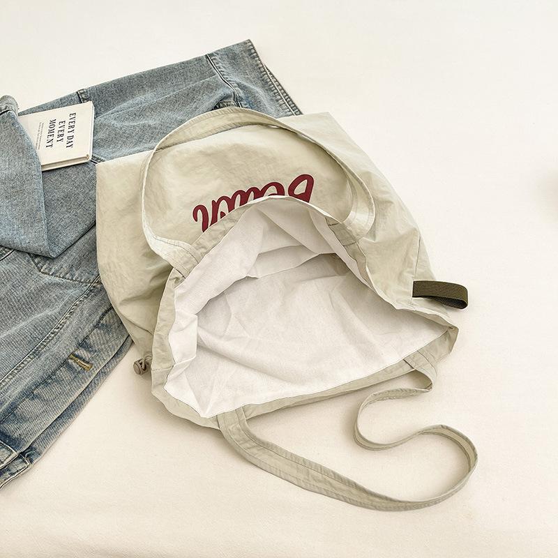Korean version of the new letter printing bag women's large-capacity nylon shoulder bag casual versatile portable drawstring tote bag