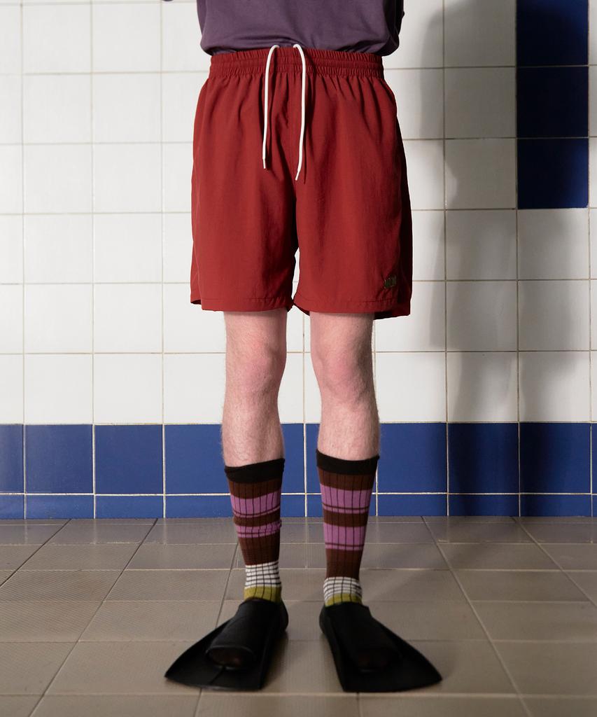UNALLOYED Logo Nylon Shorts / Brick