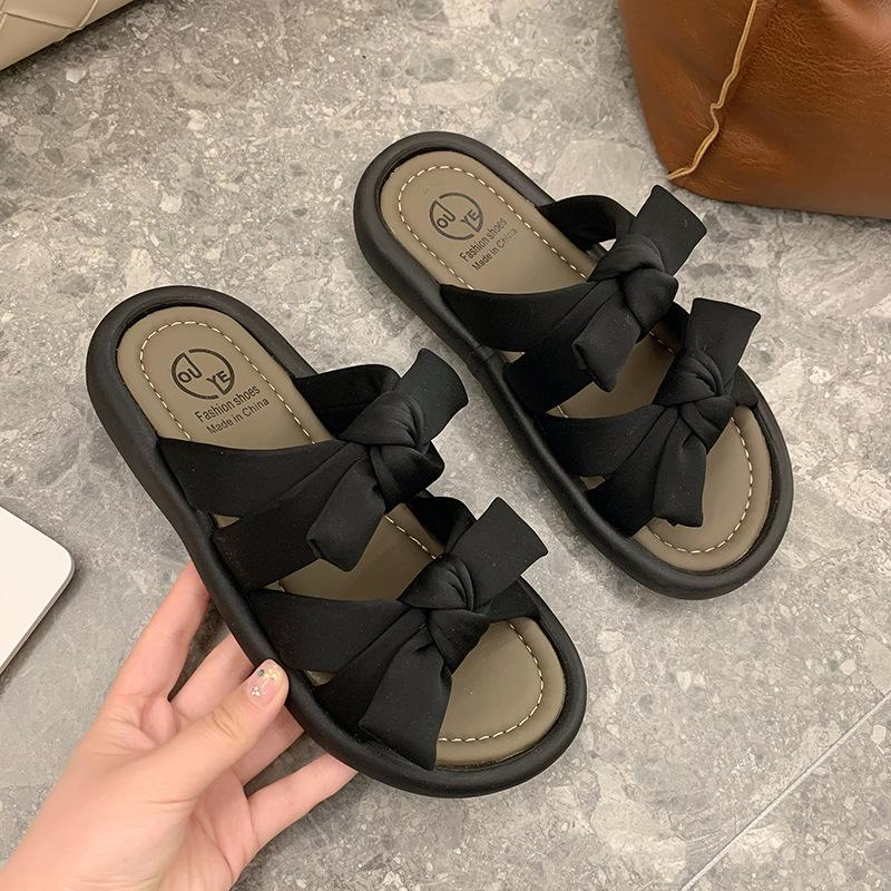 Fairy wind bow stepping on shit feeling wearing cool slippers in the summer of 2025 new versatile flat-bottomed beach one-word drag