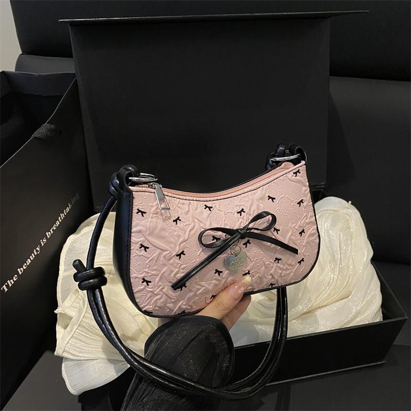 Pink super fire bow crescent armpit bag women's summer 2025 new high-end light luxury niche shoulder small square bag