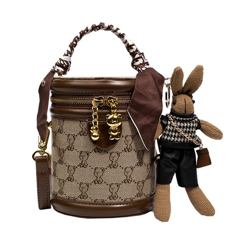 

Fashionable bucket bag, small niche cylindrical crossbody bag темно-коричневого