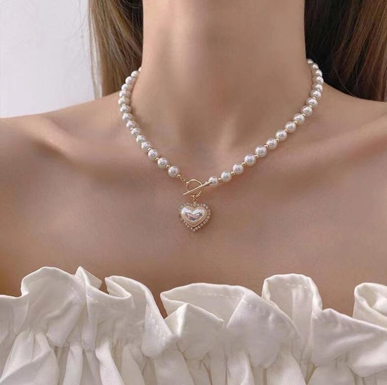 New super fairy temperament imitation pearl love necklace in Japan and South Korea, cold wind, sweet and simple OT buckle collarbone chain woman