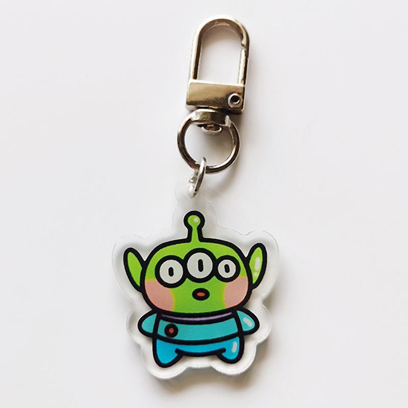 

Toy Story Three Eyes Strawberry Bear Buzz Lightyear Acrylic Keychain Transparent Pendant Cute Small Gifts