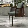 Outdoor Rattan Dining Set: Long Table with Casual Woven Chairs for Garden, Terrace, or Courtyard.