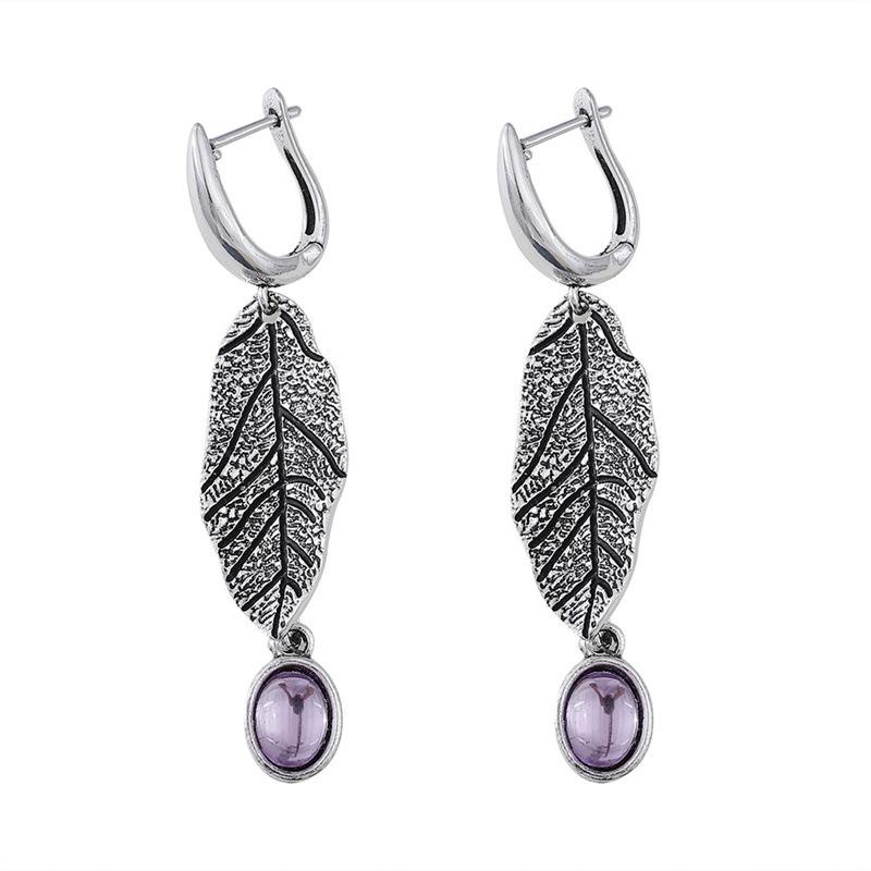 

Винтажные серьги с текстурой листьев и драгоценными камнями