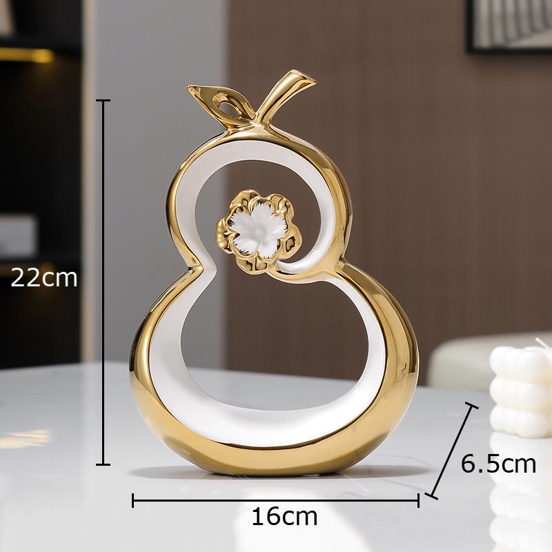 

Позолоченная полая тыква Художественное произведение Украшения Украшение стола Золотая тыква Керамика Современные ремесла Скульптура Комната Эстетический декор