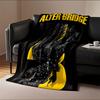 A stylized black bird entwined with yellow text and abstract line art. for all seasons blanket lunch break throw gift