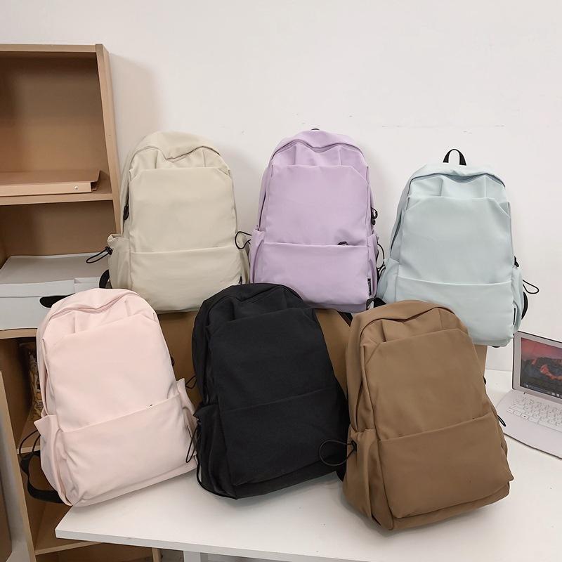 Schoolbag new large-capacity high-value junior high school student casual schoolbag Japanese and Korean version solid color fashionable simple