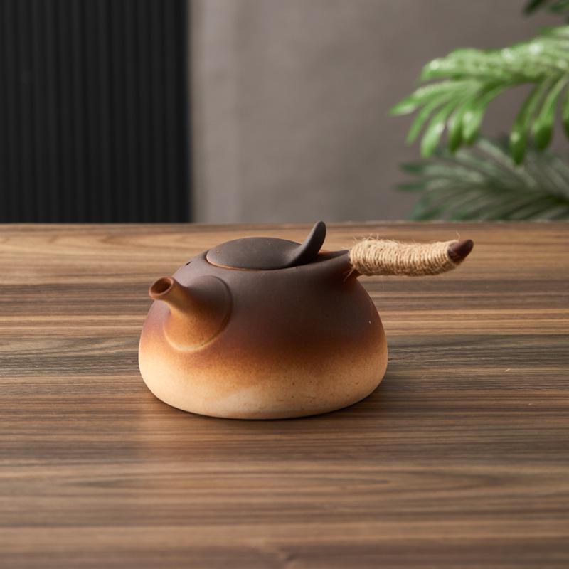 Ceramic Kung Fu Tea Set: Black Teapot with Side Handle and Charcoal Stove for Open Fire.