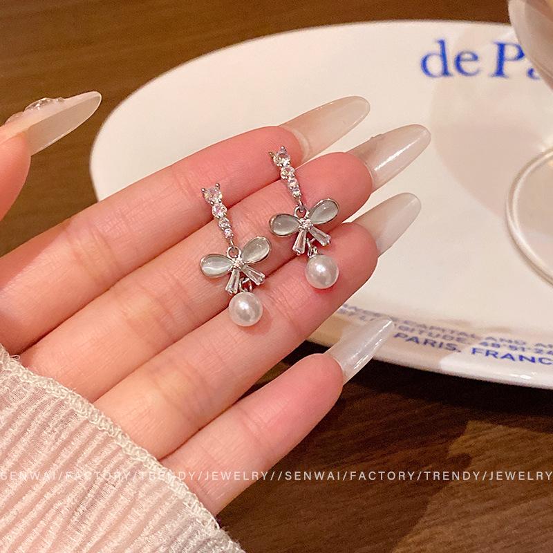 

Opal bow earrings women s design sense flash diamond pearl earrings Korean version ear jewelry