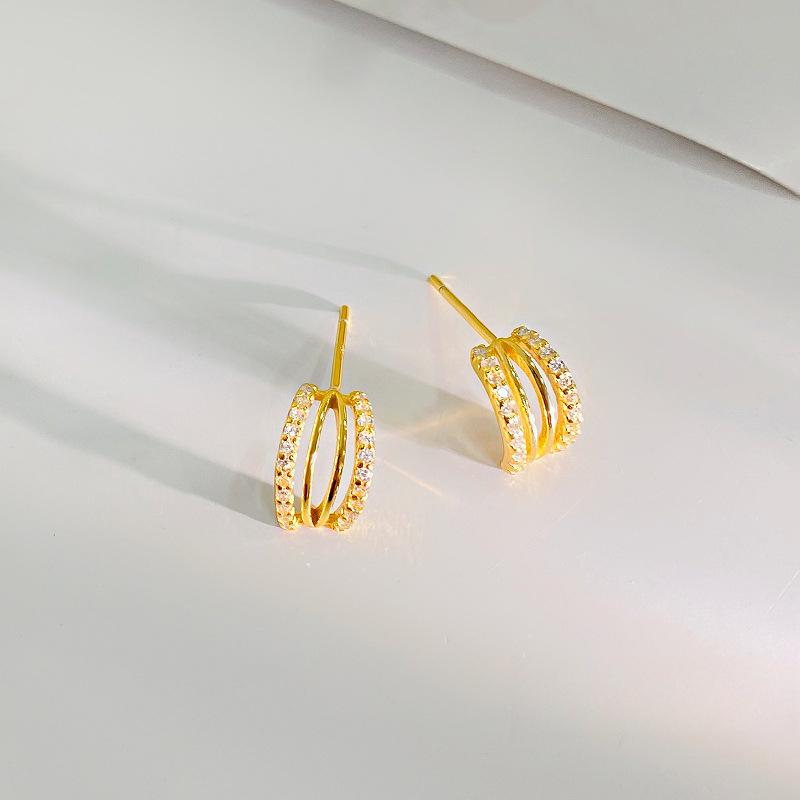 

Температурные полые изогнутые серьги для женщин с легкими роскошными геометрическими линиями высокого класса