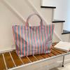 This Water-Resistant Pvc Tote Bag Features A Pink And Blue Striped Design, A Large Capacity, And Is Suitable For Beach Shopping,