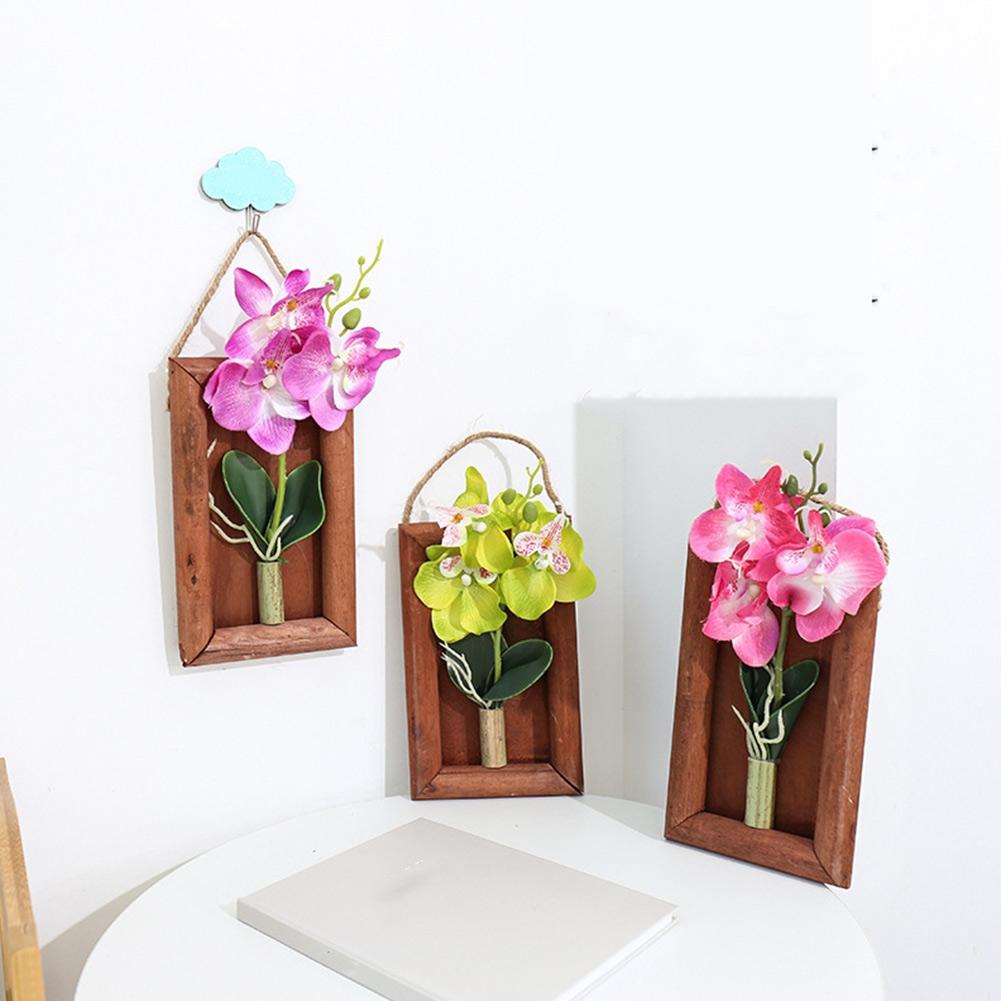 Kunstseide-Schmetterlingsorchidee mit Bilderrahmen aus Holz als Wandkunst