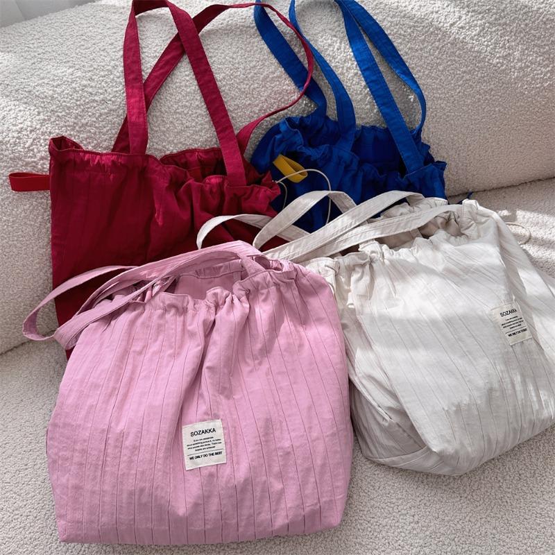 New striped drawstring shoulder bag lazy wind tote cloth bag large capacity commuter bag student class bag