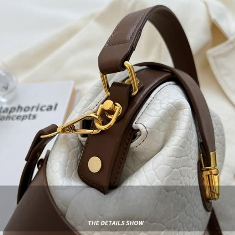 Retro Semi-round Soft Leather Rivet Corner Commuting Niche Texture Handbag