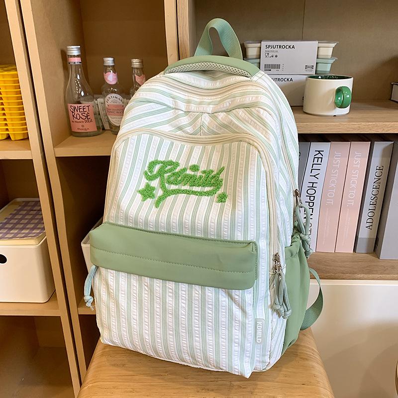 New high-value, fresh and sweet candy-colored striped backpack, high school student large-capacity backpack.