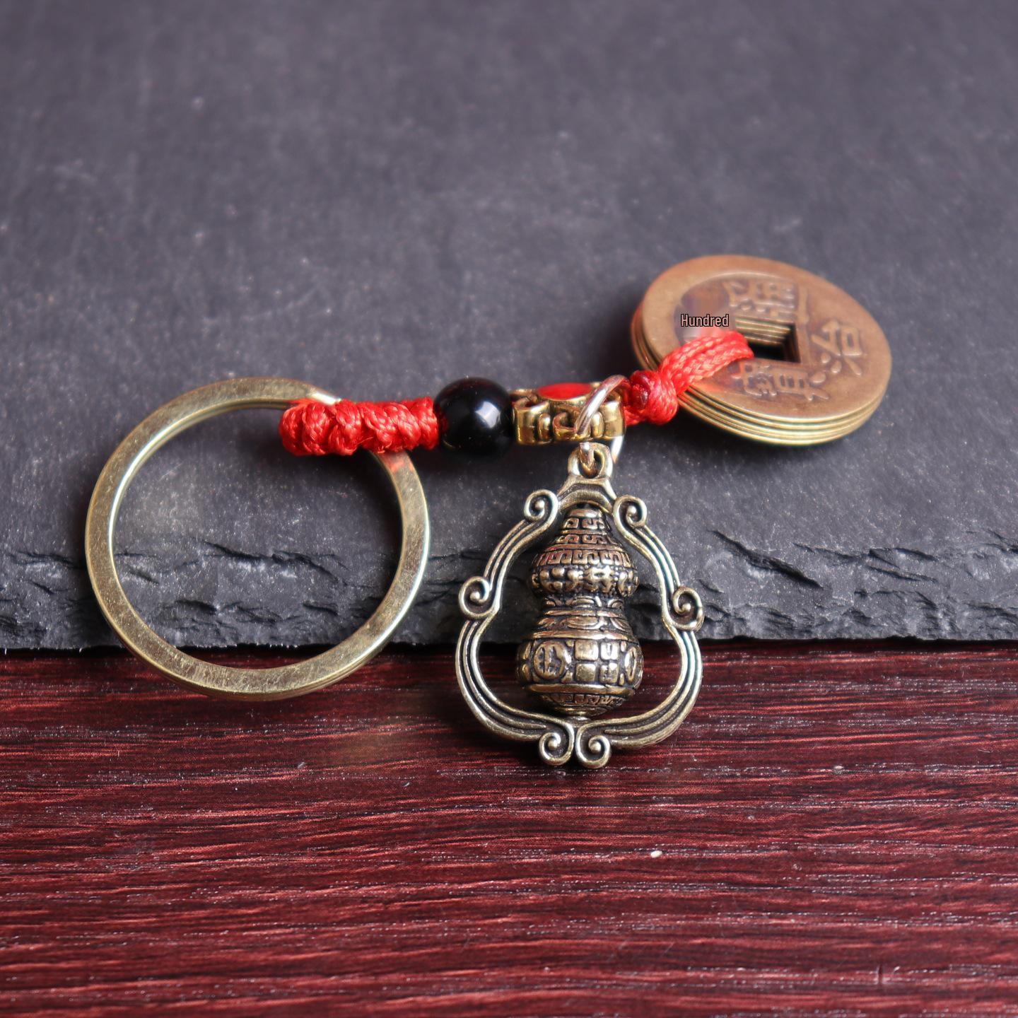 

Брелок в виде тыквы из латуни с вращающимся благоприятным облаком