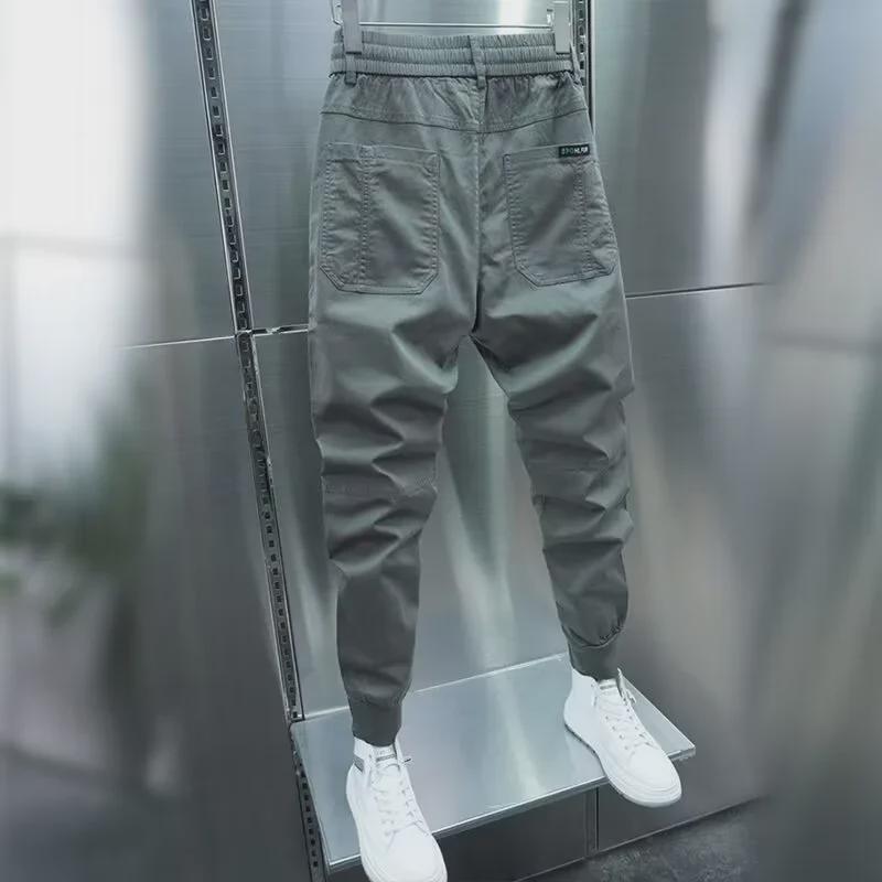 Men's Casual Slim-Fit Harem Pants: Internet Celebrity Style, Six Pockets, Solid Color, Elastic Cuffs. Perfect for Spring and Autumn.